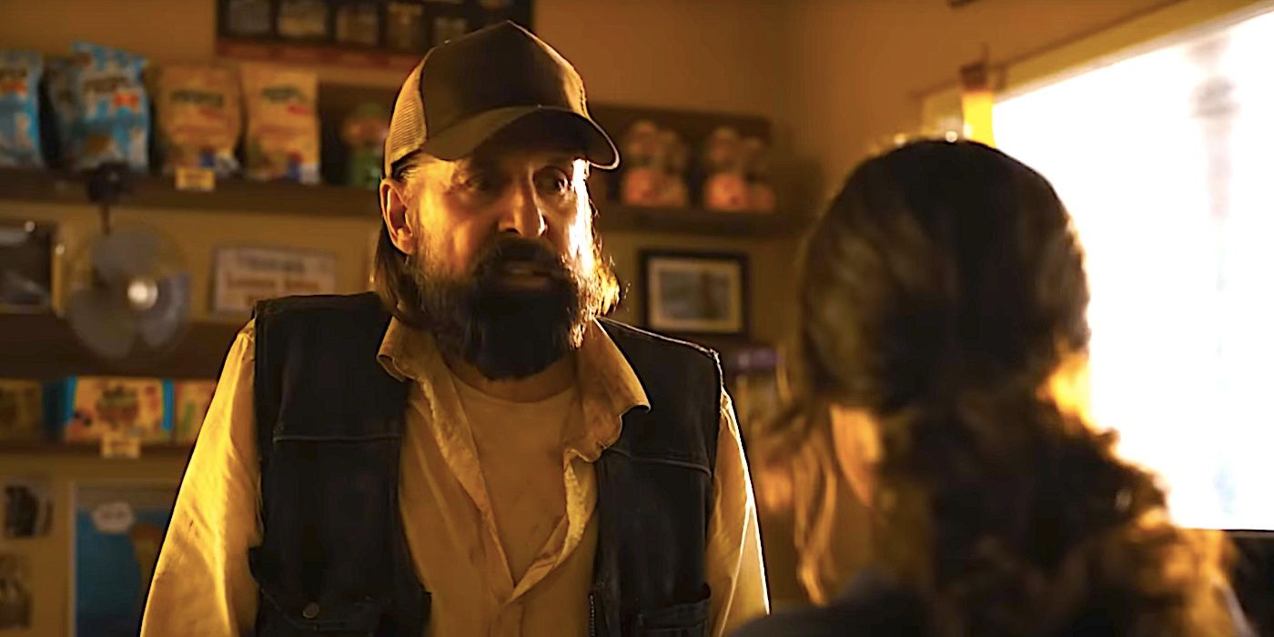 Peter Stormare's Hill stares standing at a gas station counter in Until Dawn's trailer