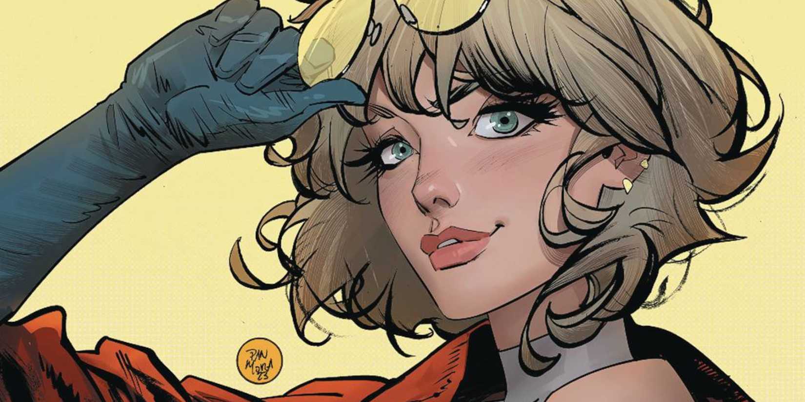 Power Girl holding a pair of sunglasses and smiling at the reader