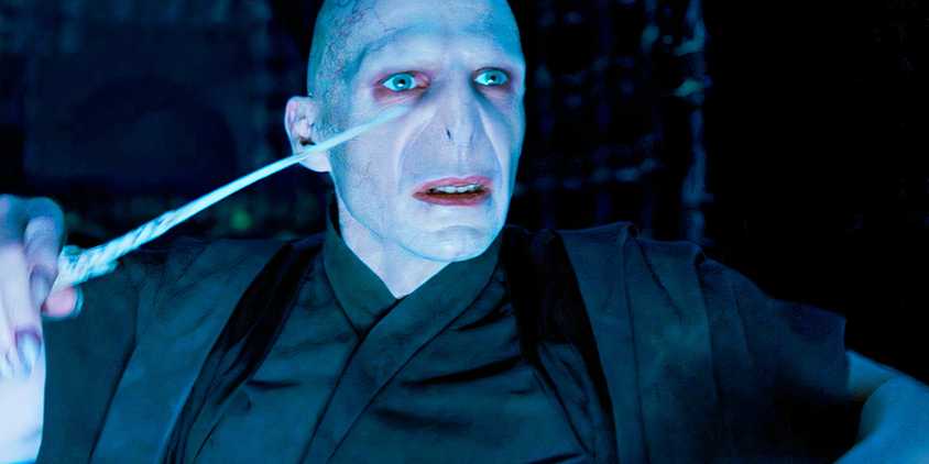 Ralph Fiennes about to cast a spell with his wand as Voldemort in Harry Potter and the Order of the Phoenix