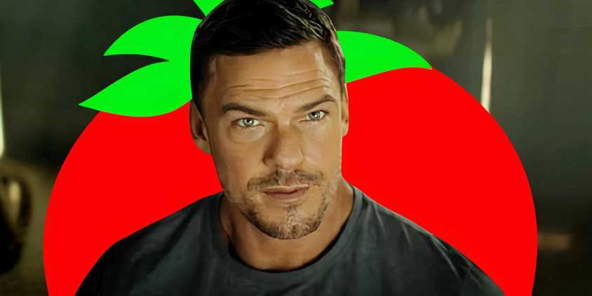 Alan Ritchson as Jack Reacher in Reacher season 3 with a Rotten Tomatoes logo behind him