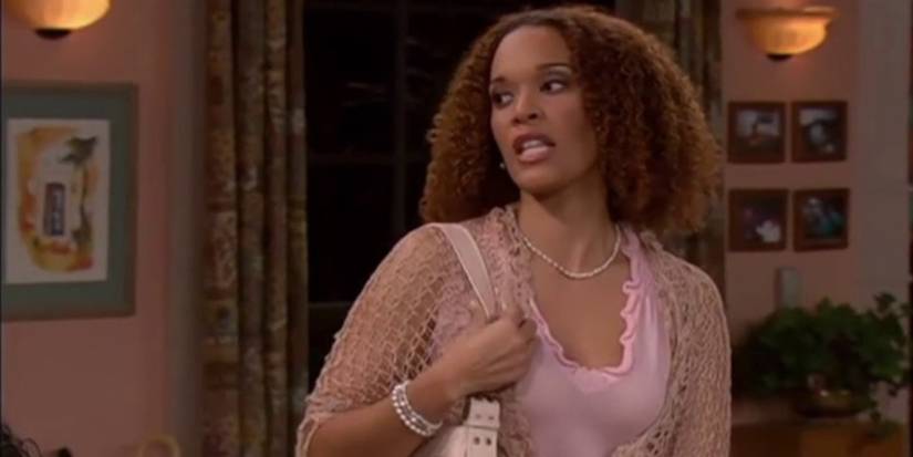 Regina close up on the parkers holding purse