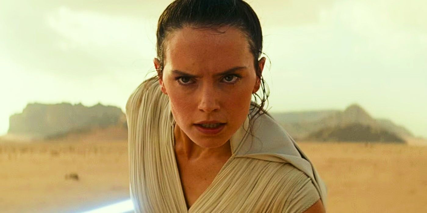 Rey (Daisy Ridley) holding her lightsaber and looking determined in The Rise of Skywalker