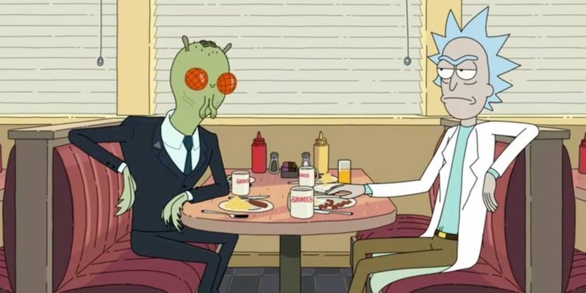 Rick sitting with an agent of the Galactic Federation inside a diner in Rick and Morty.