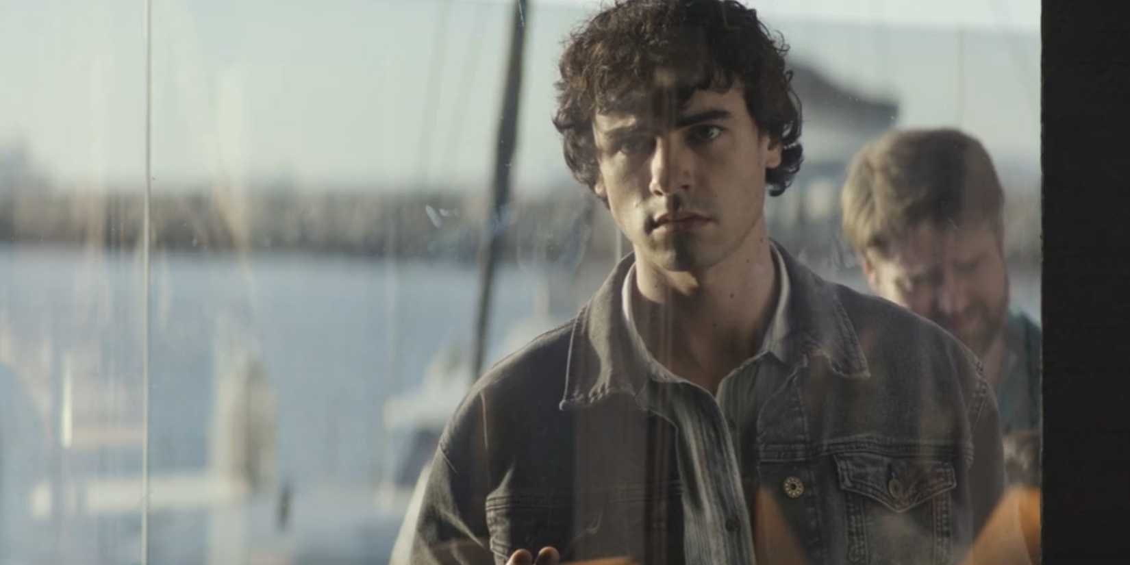 Brian Moser (Roby Attal) looking through a window at the end of Dexter: Original Sin season 1, episode 10