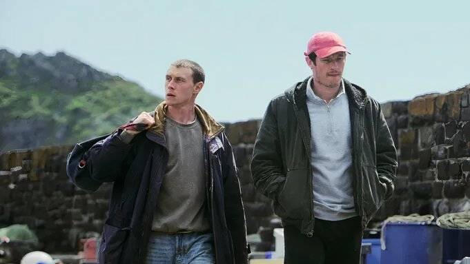 George MacKay & Callum Turner starring in Rose of Nevada, boarding a boat off the shore of Cornwall. 