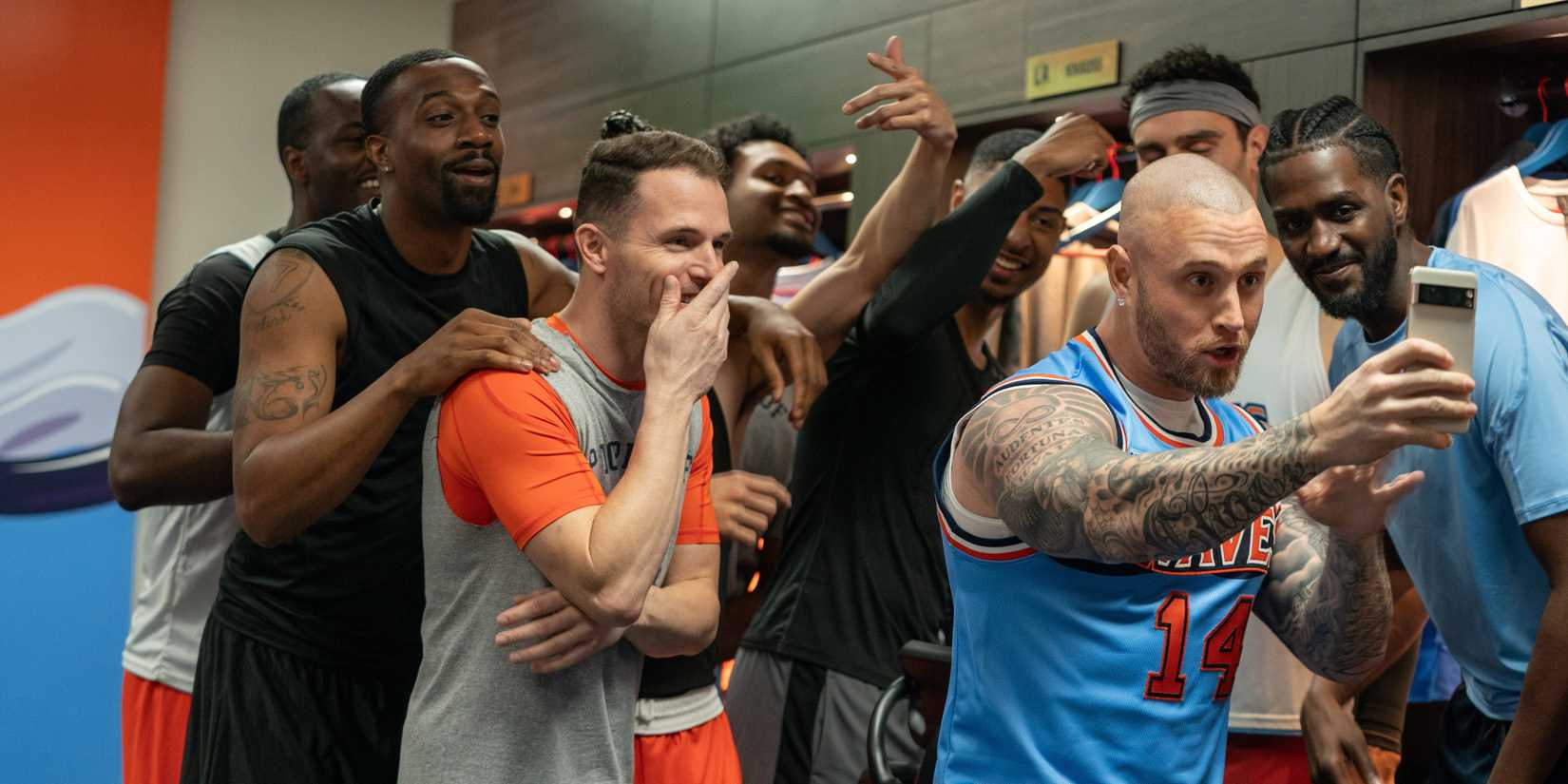 Chet Hanks As Travis Bugg Taking A Group Selfie In Netflix's Running Point Season 1, Episode 3