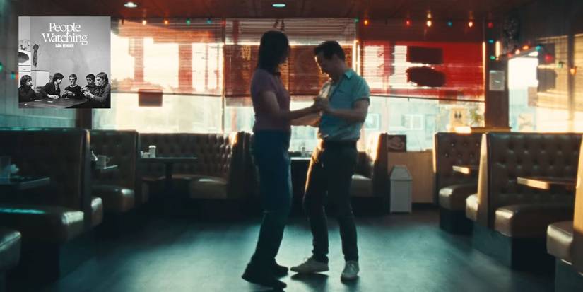 Andrew Scott dancing with a woman in the People Watching music video, the album's cover art is in the top left corner
