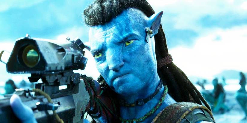 Sam Worthington as Jake Sully aiming a rifle in Avatar: The Way of Water
