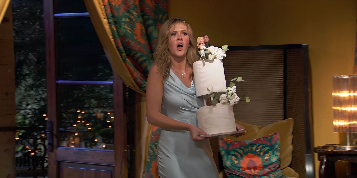 Savannah Quinn holding a wedding cake in the single