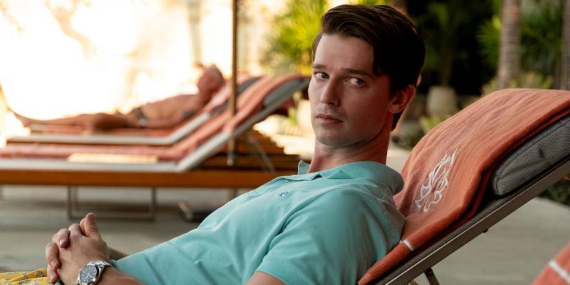 Saxon (Patrick Schwarzenegger) reclining on a chair in The White Lotus season 3 episode 3.