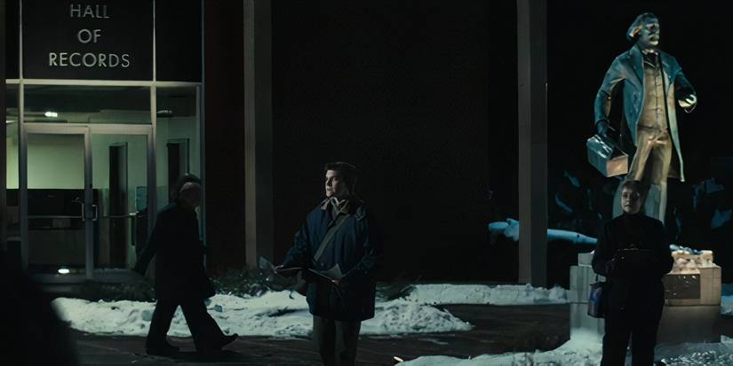 A man handing out fliers in front of the Hall of Record in Severance