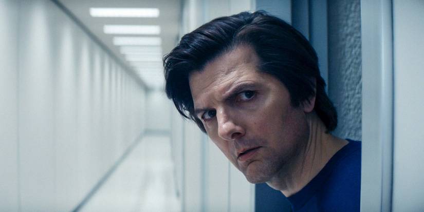 Adam Scott peering out of a door in Severance season 2 