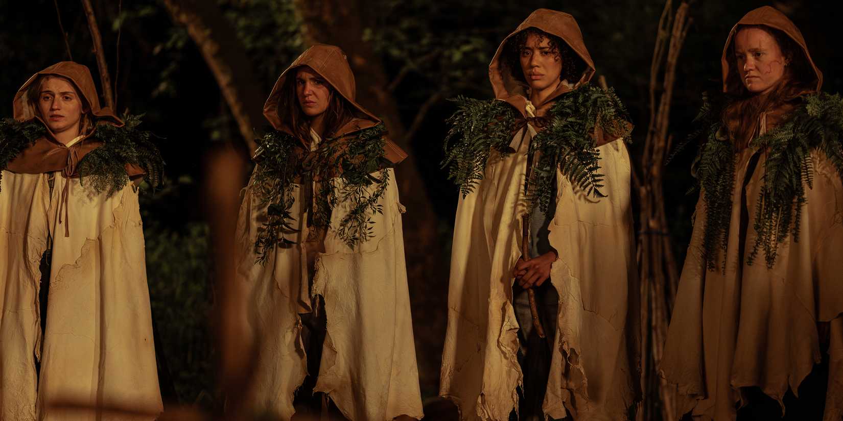 Shauna, Taissa & Van covered in cloaks for Yellowjackets season 3