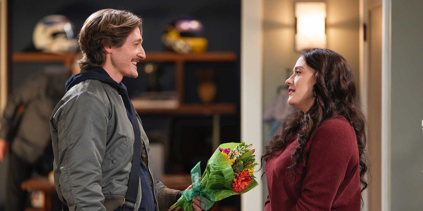 Jimmy (Lucas Neff) handing Riley (Kat Dennings) flowers in Shifting Gears episode 5.