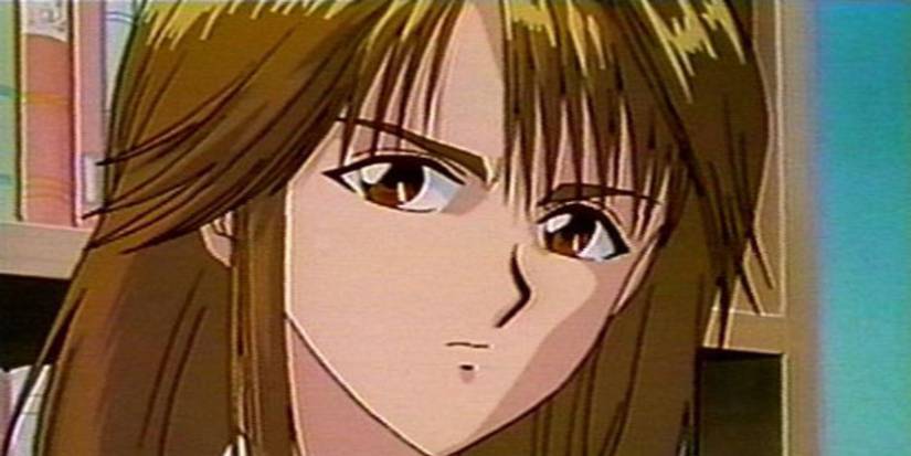 Shizuru Kuwabara (Yu Yu Hakusho) scowling in front of a bookshelf