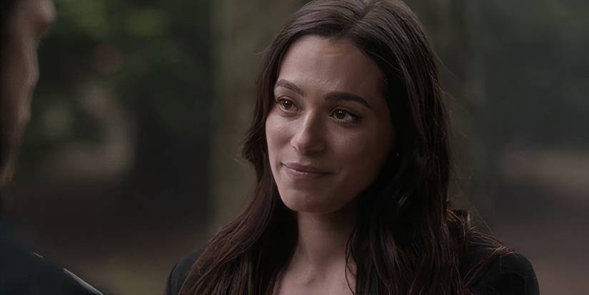 Stephanie Arcila smiling at a man offscreen in The Aliens