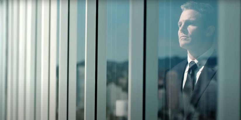 suits LA ted looking through the window