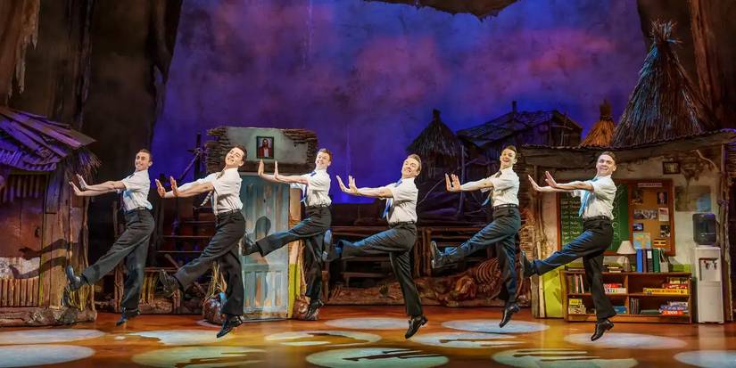 The missionaries dancing together in The Book of Mormon copy