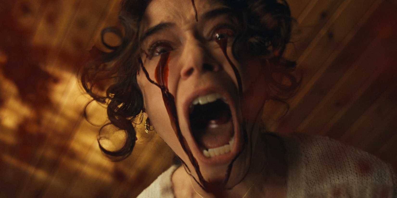 Lois (Tatiana Maslany) crying blood and screaming in terror in The Monkey