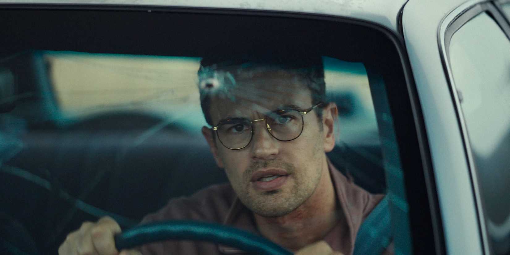 Hal (Theo James) looking at the car's shattered windshield in The Monkey