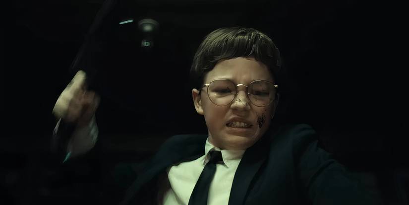 Hal holding up a cleaver in The Monkey