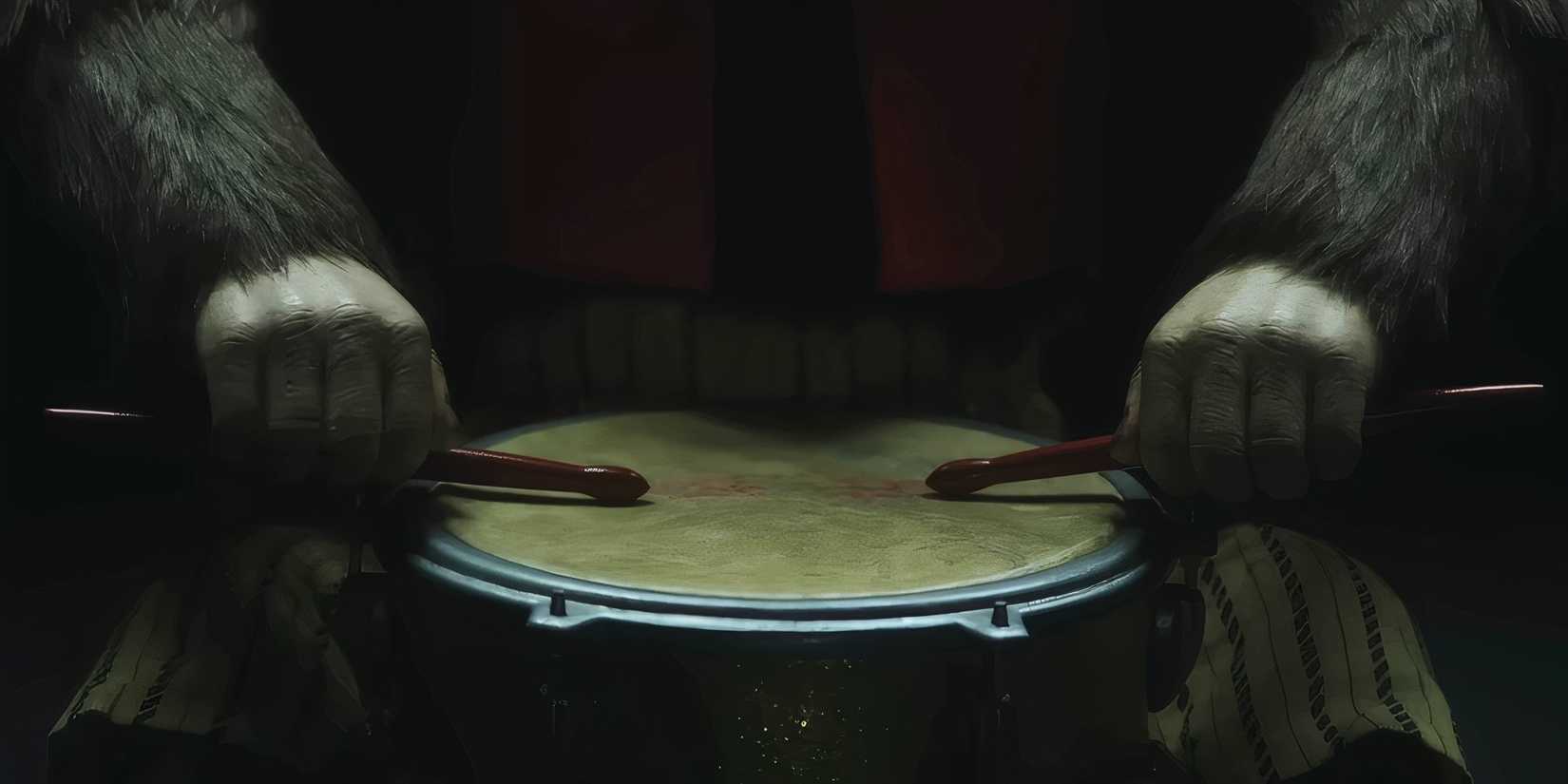 A toy monkey resting drumsticks on a drum in The Monkey