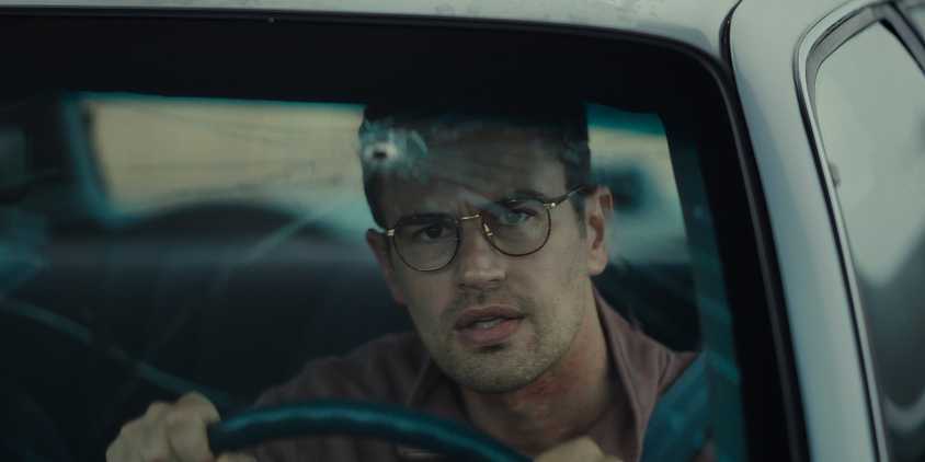 Theo James looks at a bullet hole in The Monkey