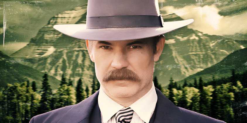 Timothy Olyphant as Seth Bullock in Deadwood in front of a mountain range