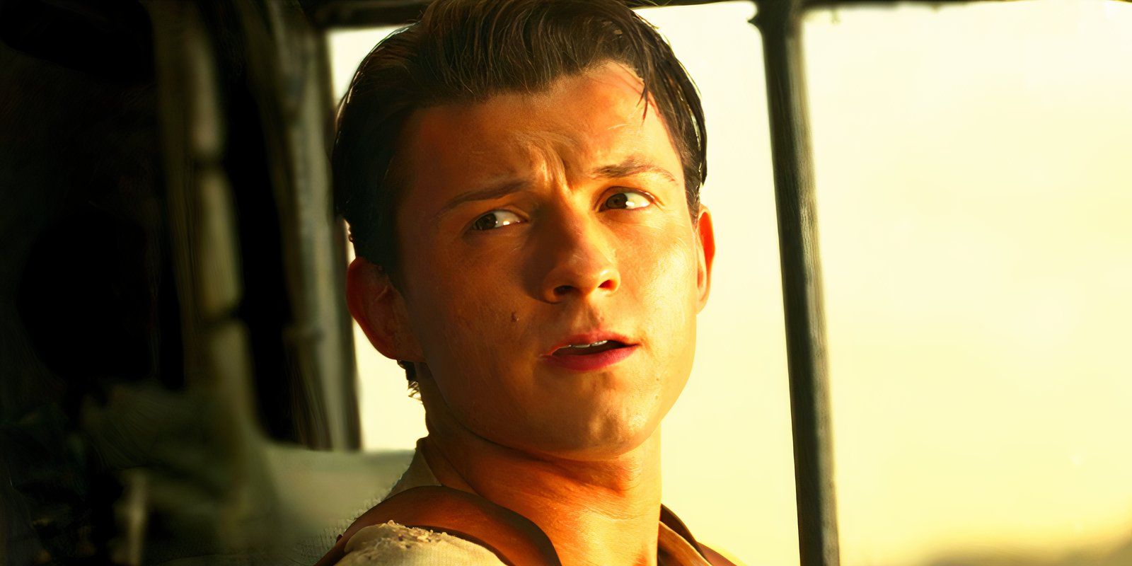 Tom Holland looking mildly concerned as Nathan Drake in Uncharted