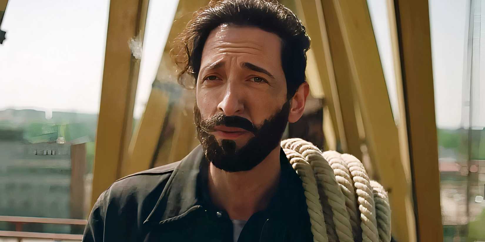 Adrien Brody raising his eyebrows in The Brutalist