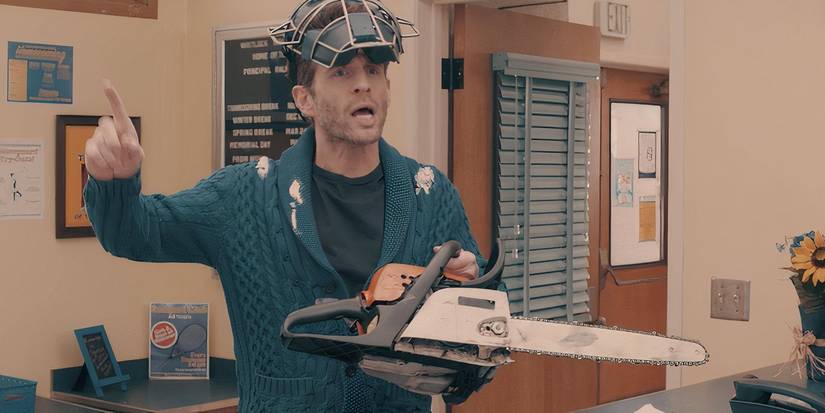 Glenn Howerton as Jack Griffin wearing a helmet and carrying a chainsaw in A.P. Bio episode "Gary Meets Dave."