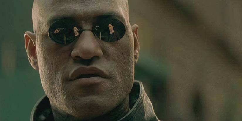Lawrence Fishburne as Morpheous talking to Keanu Reeves as Neo, who is reflected in his glasses, in The Matrix.