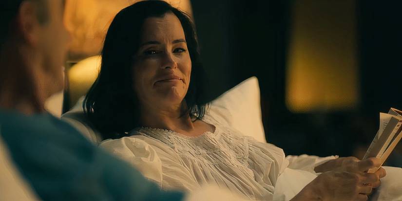 Victoria smiling in bed with a book in The White Lotus season 3 (2025)