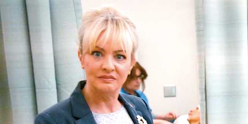 Wendi McLendon-Covey's Joyce stares at the camera in St Denis Medical