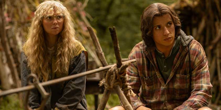 Young Misty sitting next to Travis in Yellowjackets season 3