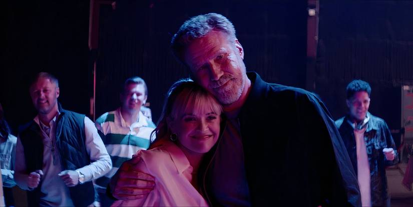 Jim (Will Ferrell) and Margot (Reese Witherspoon) hugging in You're Cordially Invited.