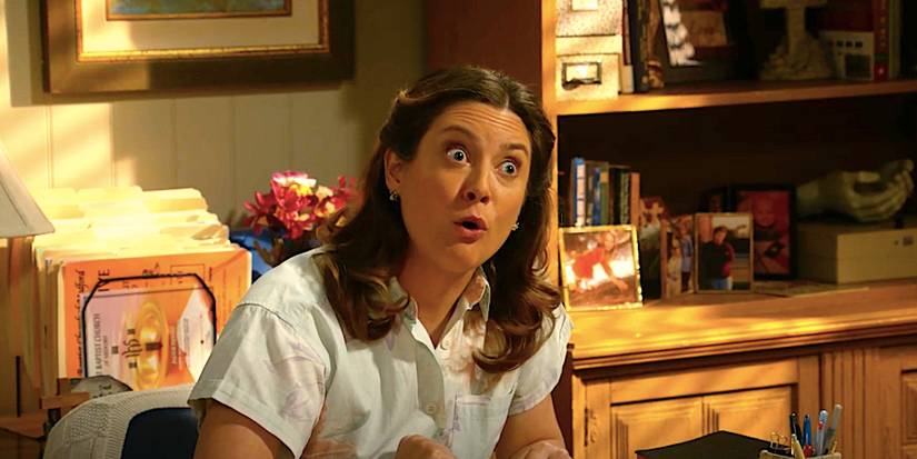Zoe Perry's Mary looking angry sitting at a desk in Georgie and Mandy's First Marriage episode 10