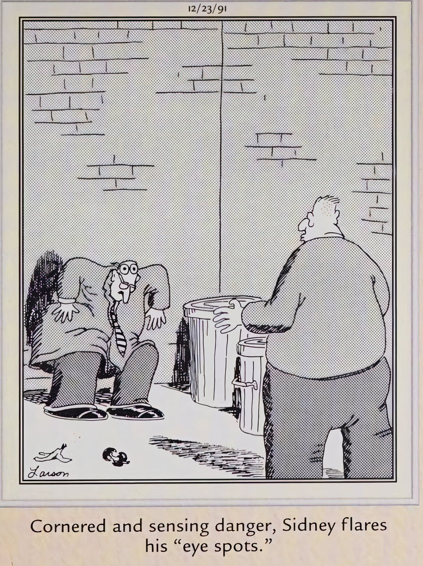 A man showing another man a pair of fake eyes to scare him off in The Far Side.