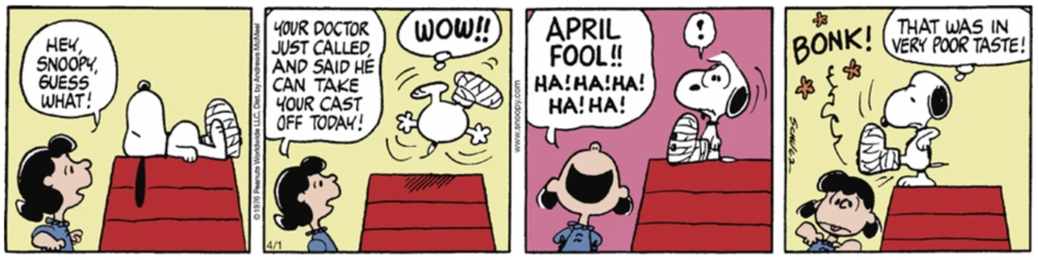 Snoopy hitting Lucy on the head with his leg cast.