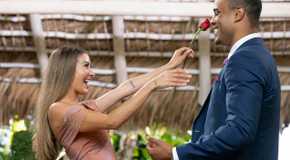 Juliana Pasquarosa and Grant Ellis reach to embrace each other on The Bachelor