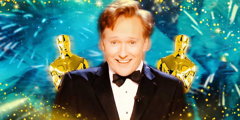 Conan O'Brien is in front of two Oscars.
