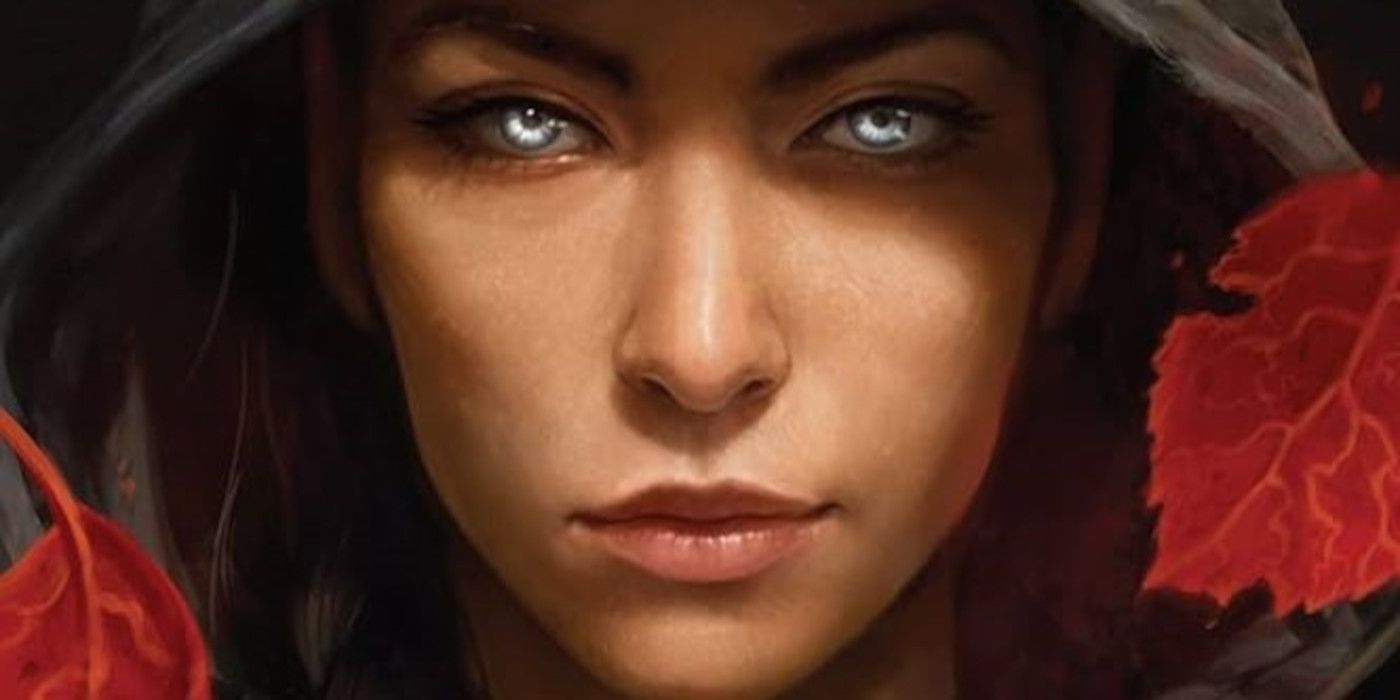 The cover of A Broken Blade By Melissa Blair featuring a woman with blue eyes and a black hood covering her head
