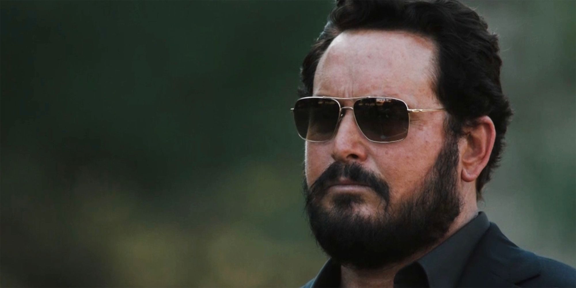 A close up of Rip Wheeler wearing sunglasses in Yellowstone season 5