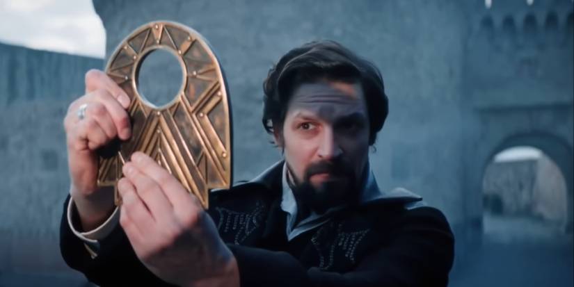 A man holding up a magical artifact in The Librarians The Next Chapter