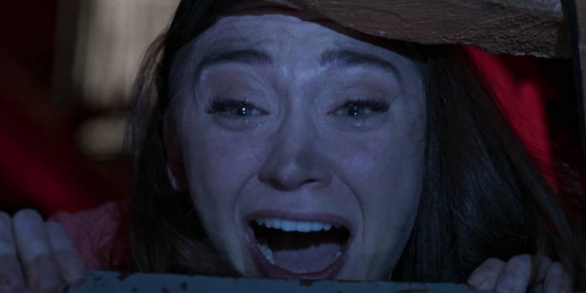 A woman screaming with tears in her eyes in Screamboat