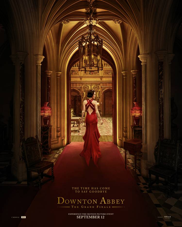 A woman walking down an ornate hallway on the poster for Downton Abbey The Grand Finale