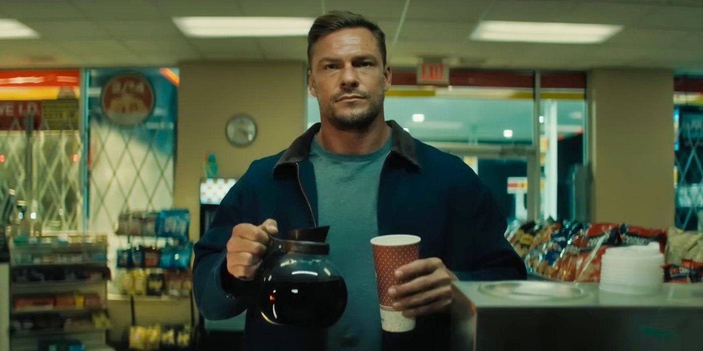 Alan Ritchson as Jack Reacher holding a coffee pot in Reacher season 3