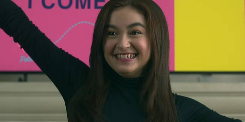 Anna cathcart in XO, Kitty raising hand and smiling