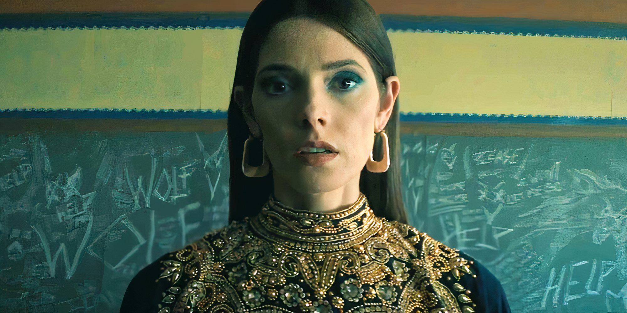 Ashley Greene It Feeds looking surprised standing in front of a chalkboard