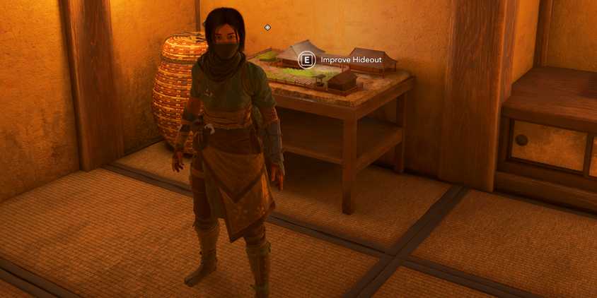 Naoe standing in front of the Hideout upgrade table in Assassin's Creed Shadows